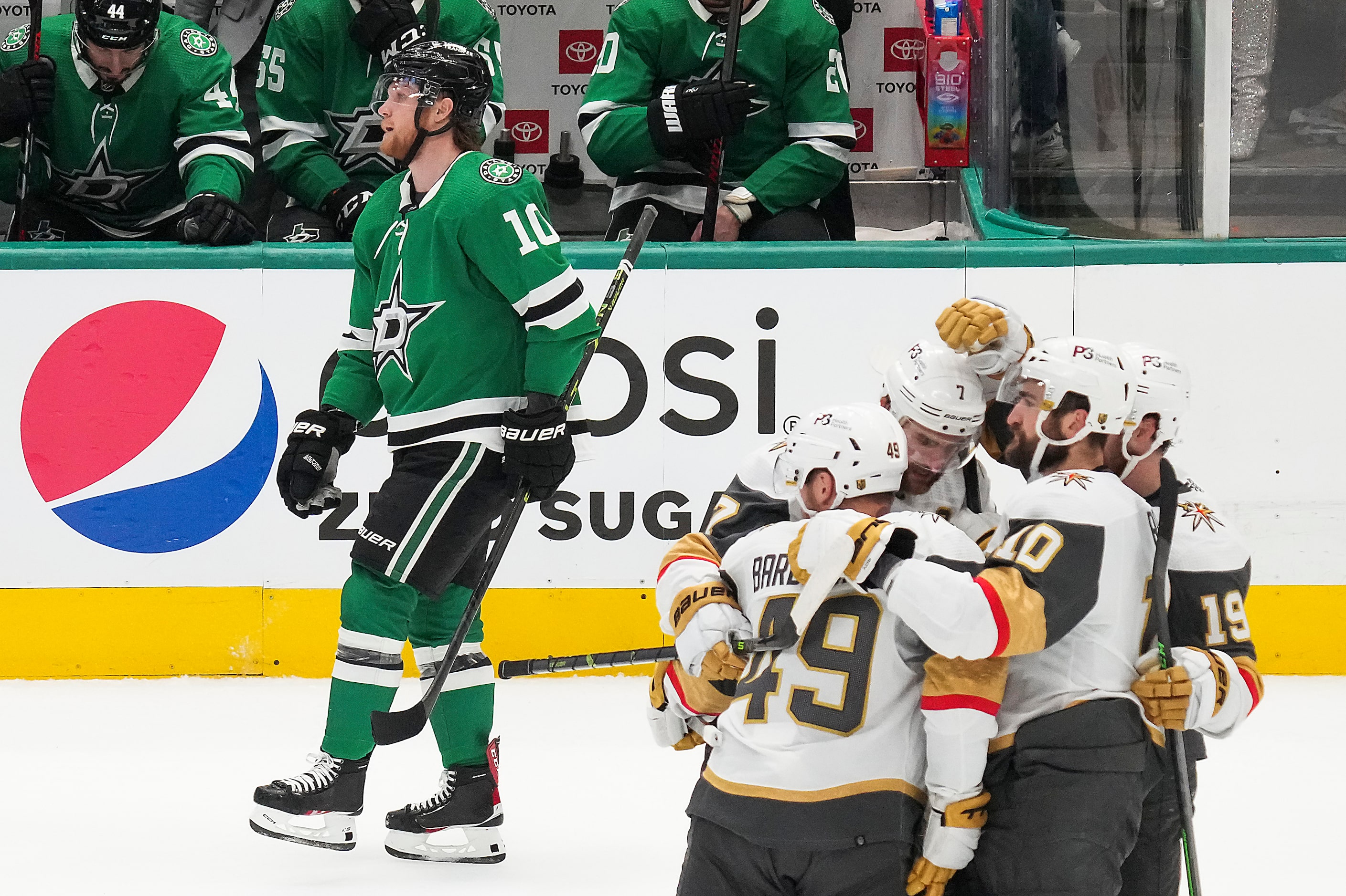 Vegas Golden Knights center Ivan Barbashev (49) celebrates with teammates defenseman Alex...