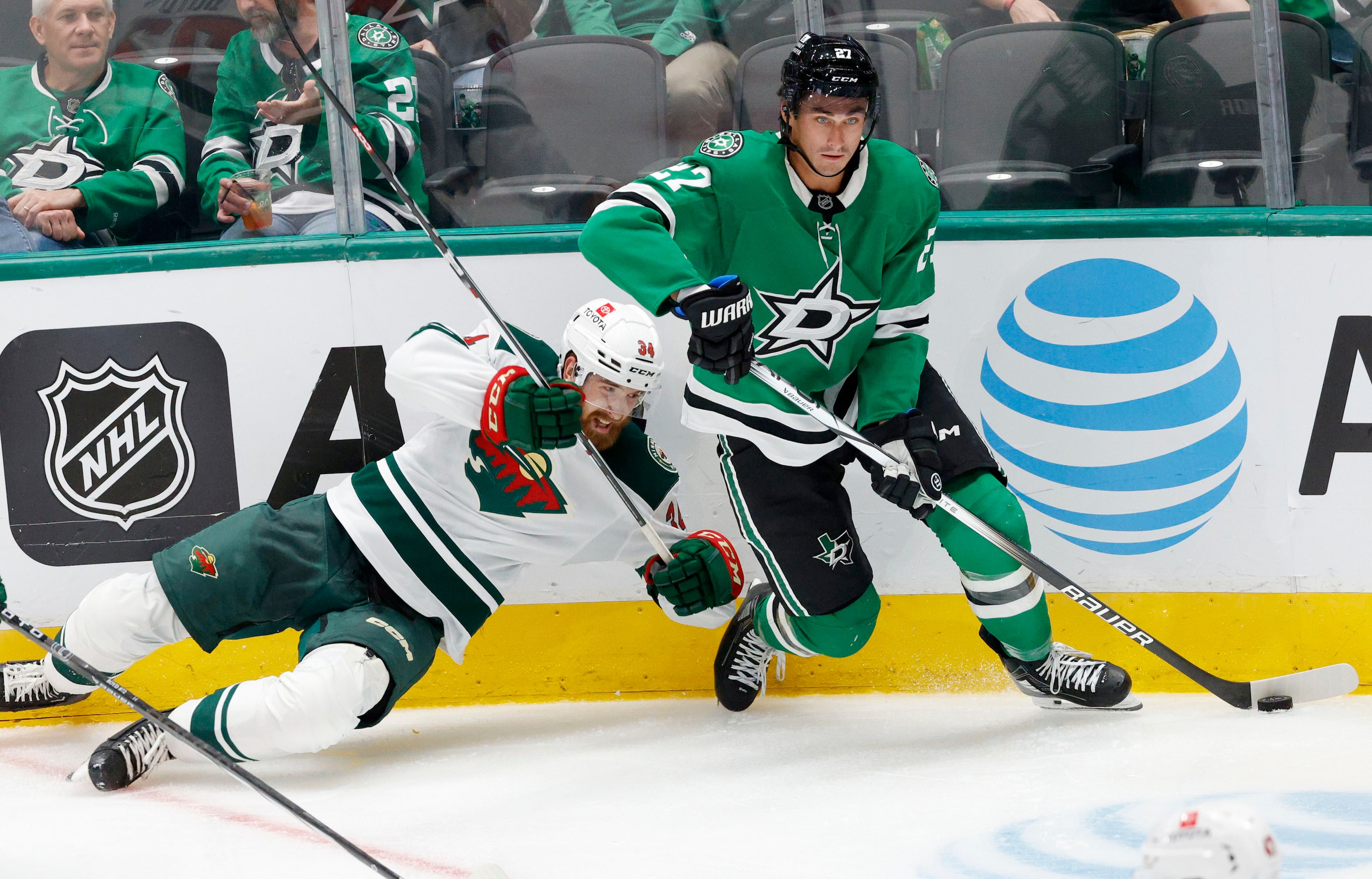 Dallas Stars left wing Mason Marchment (27) controls the puck against Minnesota Wild...