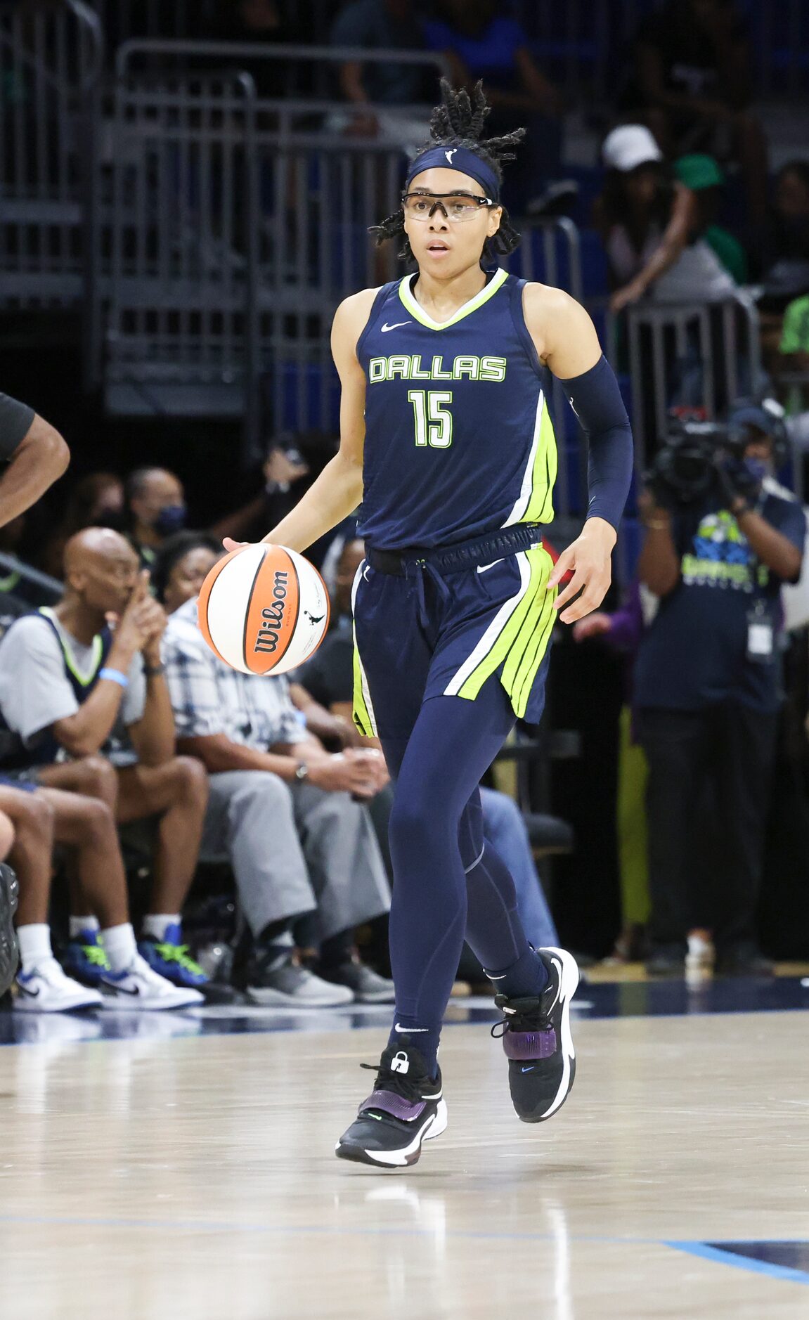 Dallas Wings guard Allisha Gray (15) dribbles the ball up the court in the game against Las...