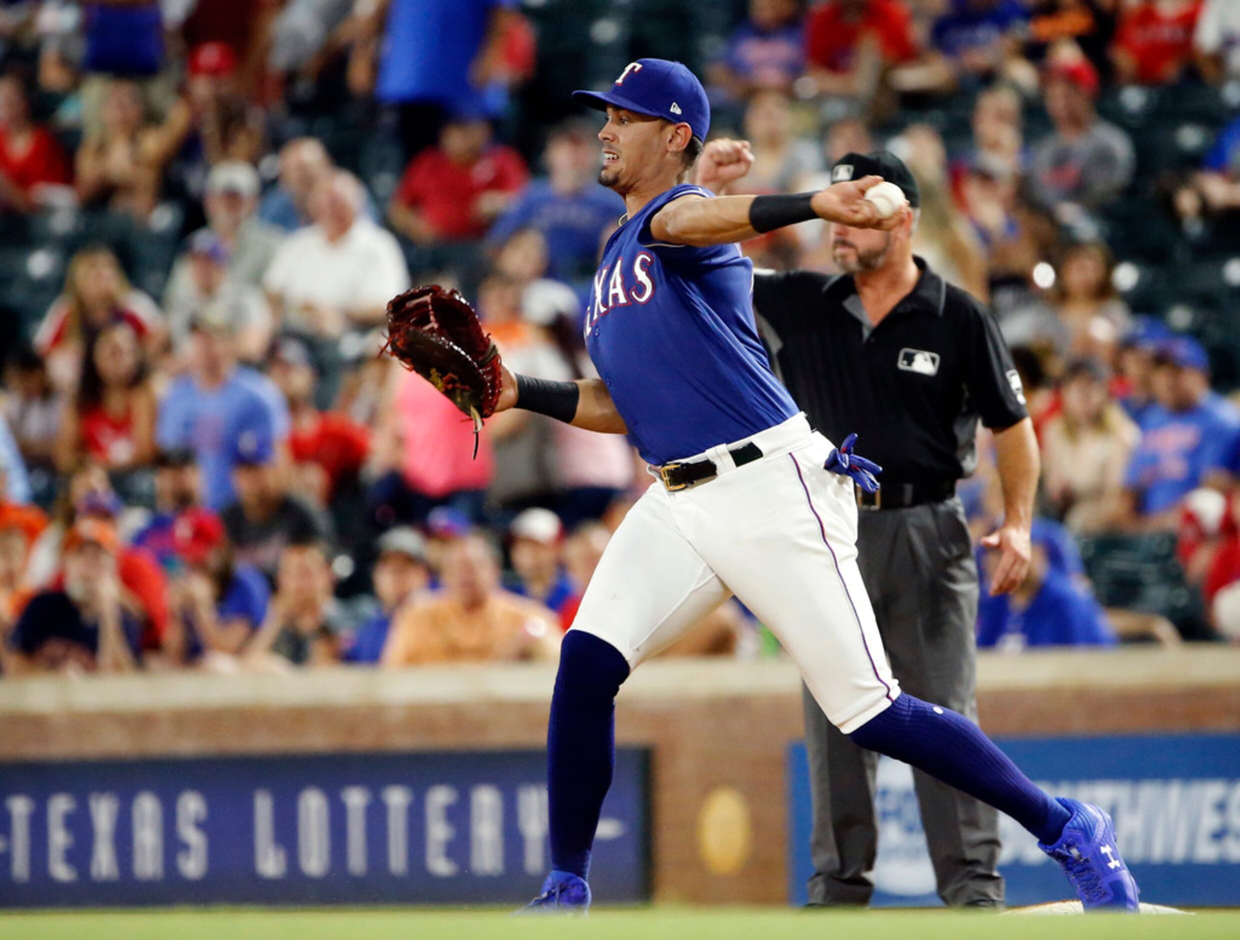 Texas Rangers first baseman Ronald Guzman (11) turns the front end of a double play getting...