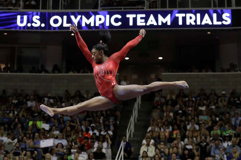 FILE - In this Sunday, July 10, 2016, file photo, Simone Biles competes on the balance beam...