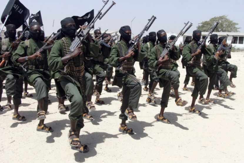 The terror group al-Shabab, like these fighters performing military exercises, used its base...