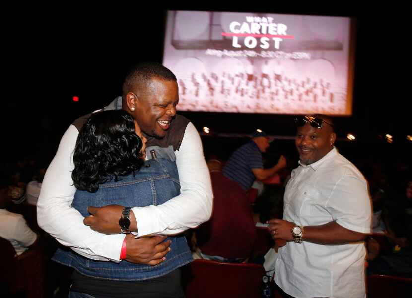 Former Carter High School football standout Derric Evans (left) of Houston is greeted by old...