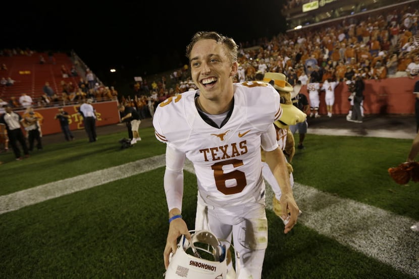 Texas quarterback Case McCoy runs off the field after an NCAA college football game against...
