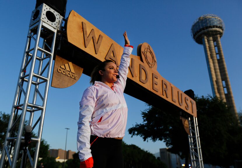 Celebrity trainer Alli Forsythe leads a pre-race stretch  for yoga enthusiasts participating...