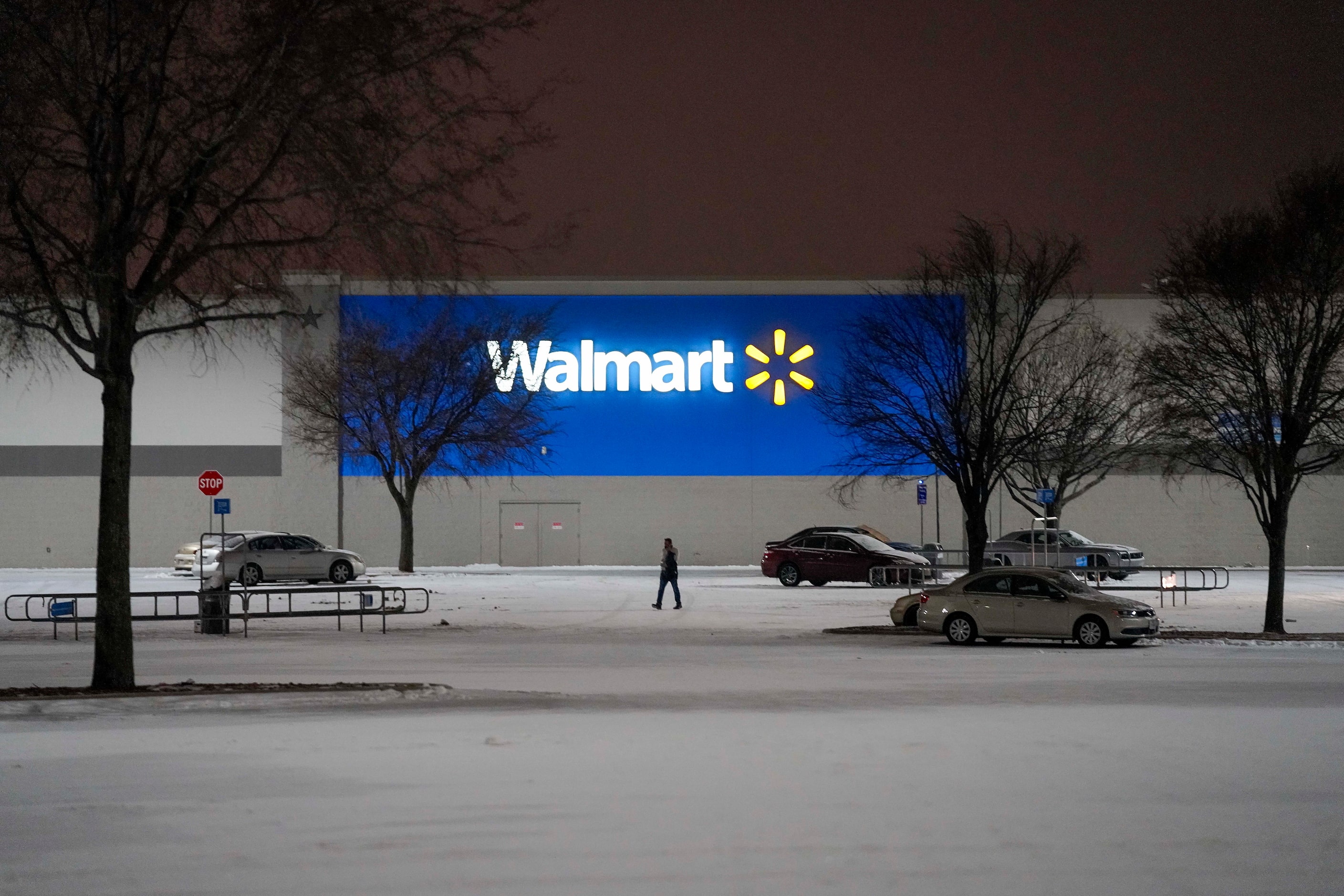 The parking lot of a Walmart Store on Coit Road empties as a second winter storm brought...