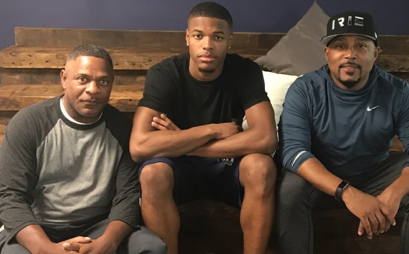 Left to right, Dennis Smith Sr, Dennis Smith Jr. and Daymond John. John gave Smith Sr. and...