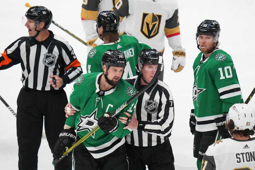 Dallas Stars left wing Jamie Benn (14) is sent off the ice after collecting a five minute...