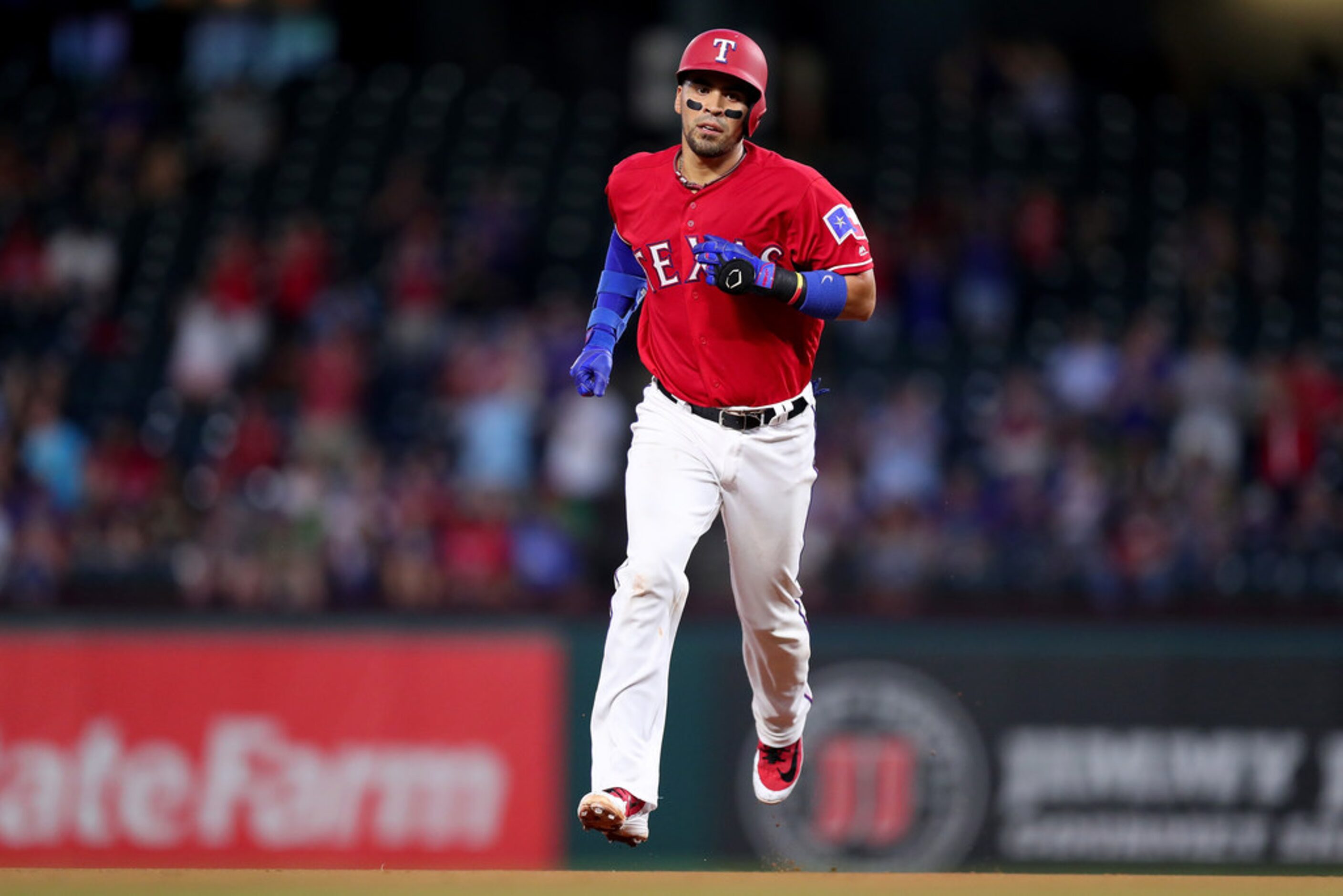 ARLINGTON, TX - AUGUST 13:  Robinson Chirinos #61 of the Texas Rangers rounds the bases...