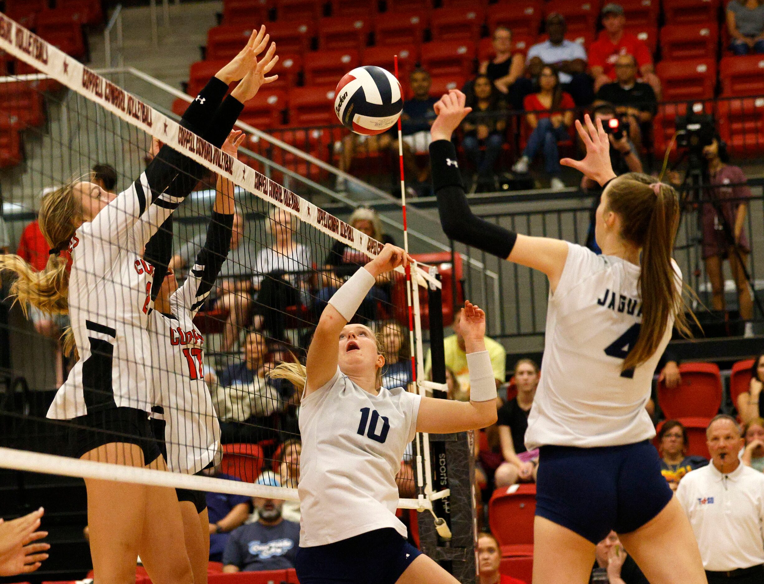 Coppell's Mira  Klem (2), left, and Coppell's Brooke Felix (17) block the ball against...