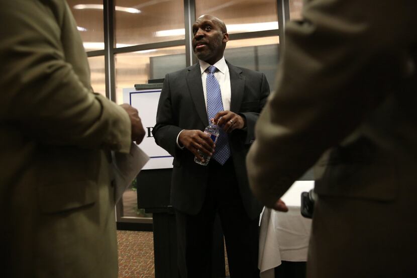 T.C. Broadnax, a city manager candidate, speaks to community members during a meet and greet...