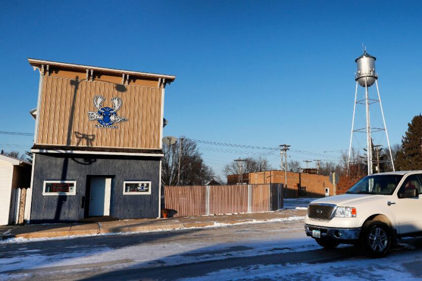 A pickup passes the Blue Moose Saloon which opened in September in Renwick, Iowa, on...