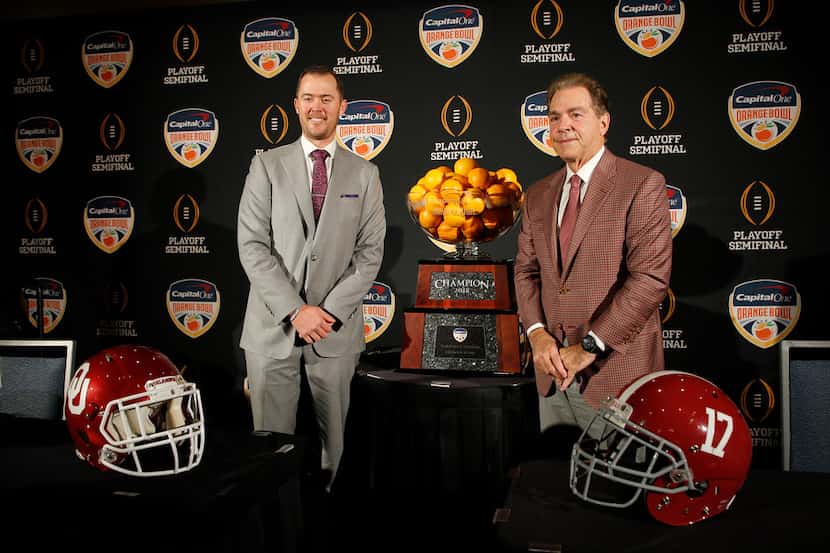 Alabama head coach Nick Saban, right, stands with Oklahoma head coach Lincoln Riley at an...