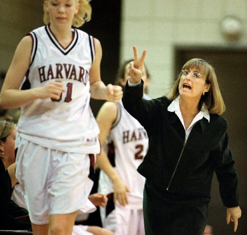 Kathy Delaney-Smith, head coach of the Harvard women's basketball team, substitutes Sarah...