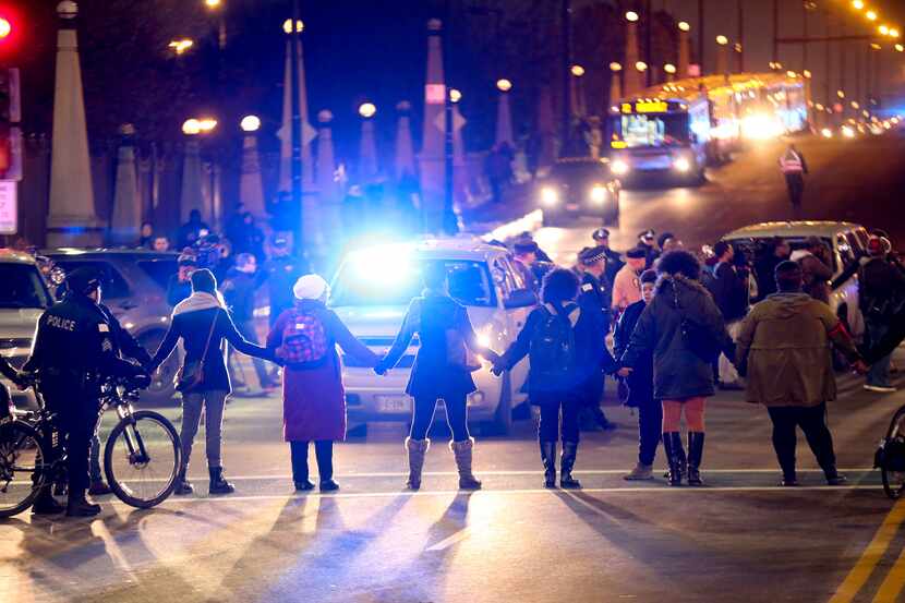 Protesters form a circle at the intersection of South State Street and West Roosevelt Road...