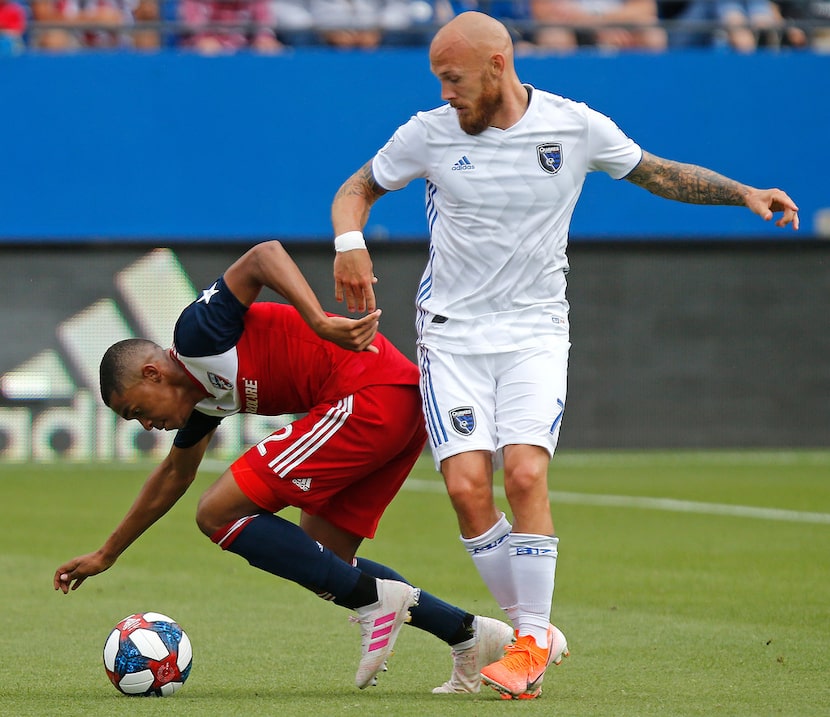 San Jose Earthquakes midfielder Magnus Eriksson (7) collides with FC Dallas defender Reggie...