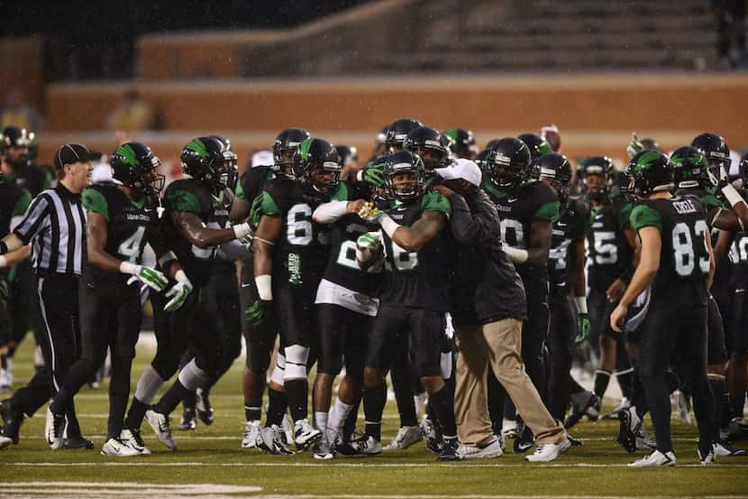 North Texas players celebrate during a game last season. Most preseason projections have the...