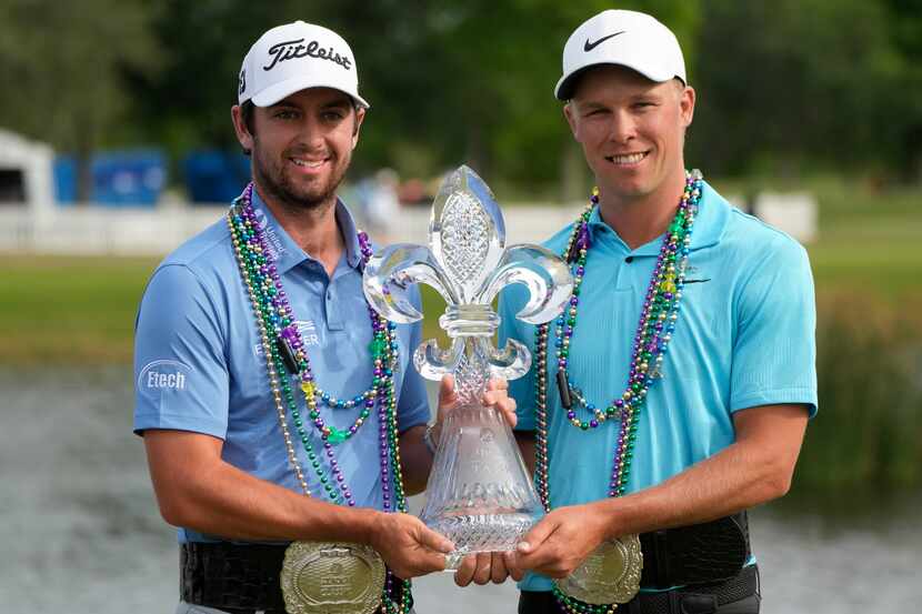 Davis Riley, left, and teammate Nick Hardy hold their trophy after winning the PGA Zurich...