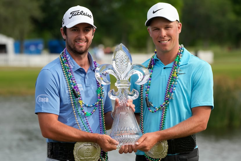 Davis Riley, left, and teammate Nick Hardy hold their trophy after winning the PGA Zurich...