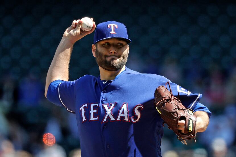 Texas Rangers starting pitcher Lance Lynn throws against the Seattle Mariners in the first...