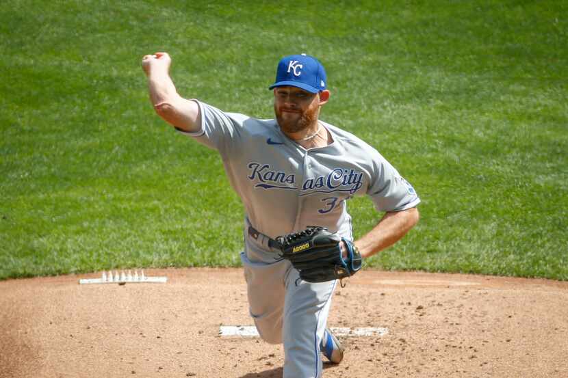 Kansas City Royals starting pitcher Ian Kennedy throws to the Minnesota Twins in the first...