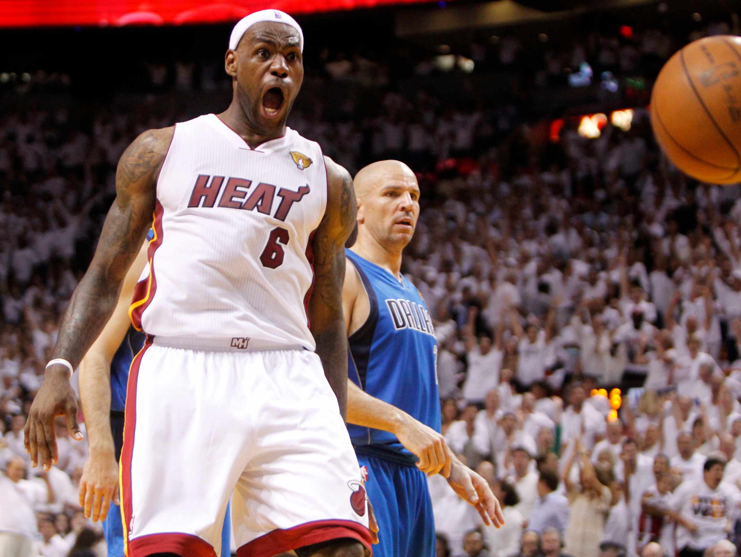 Miami Heat small forward LeBron James (6) reacts after dunking the ball in a game against...