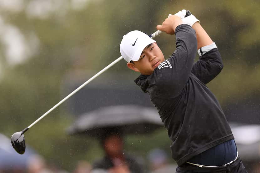 Tom Kim of South Korea tees off on the 5th hole on Day Four of The 151st Open at Royal...