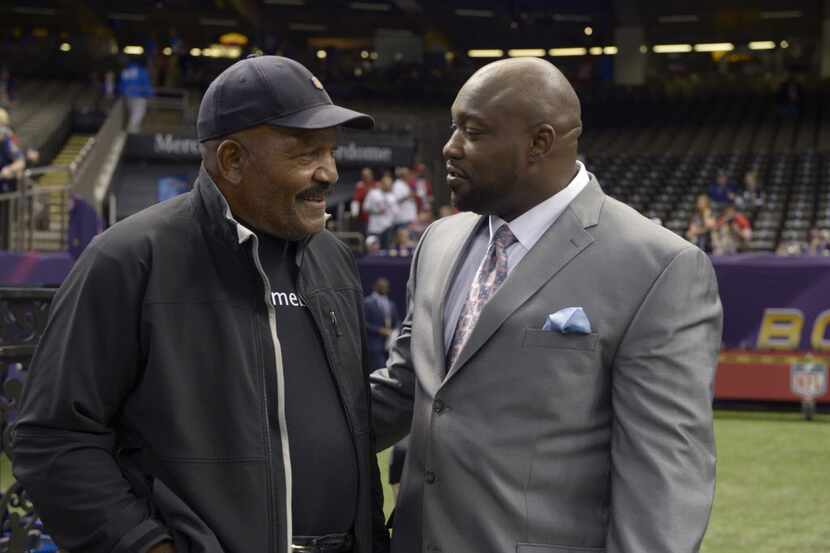 Feb 3, 2013; New Orleans, LA, USA; Former player Jim Brown (left) talks with sportscaster...