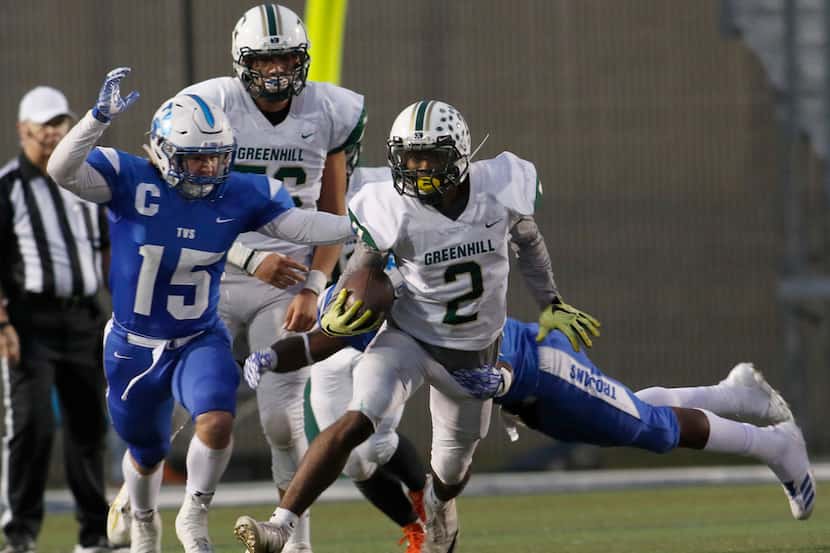 Greenhill  back Xavier Bryant (2) attracts the attention of Trinity Valley defenders Isaiah...