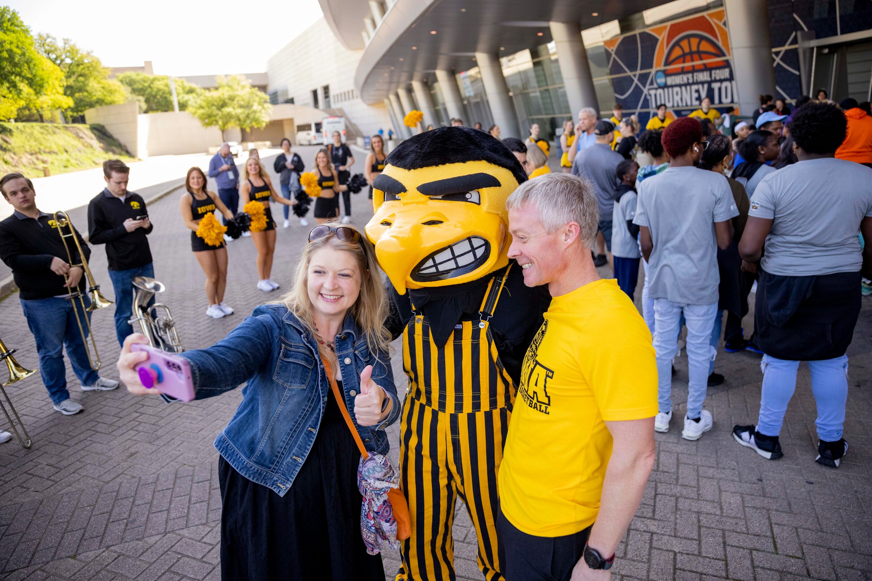 Sandy and Jeff Kreinbring of Iowa City, IA take a selfie with Iowa’s mascot “Herky the Hawk”...