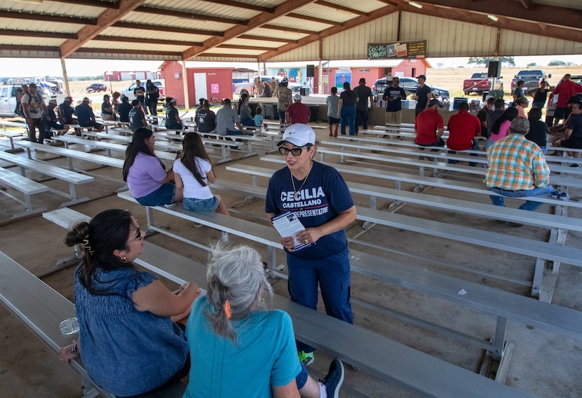 Cecilia Castellano talks with voters and hands out flyers during a barbecue cookoff in...