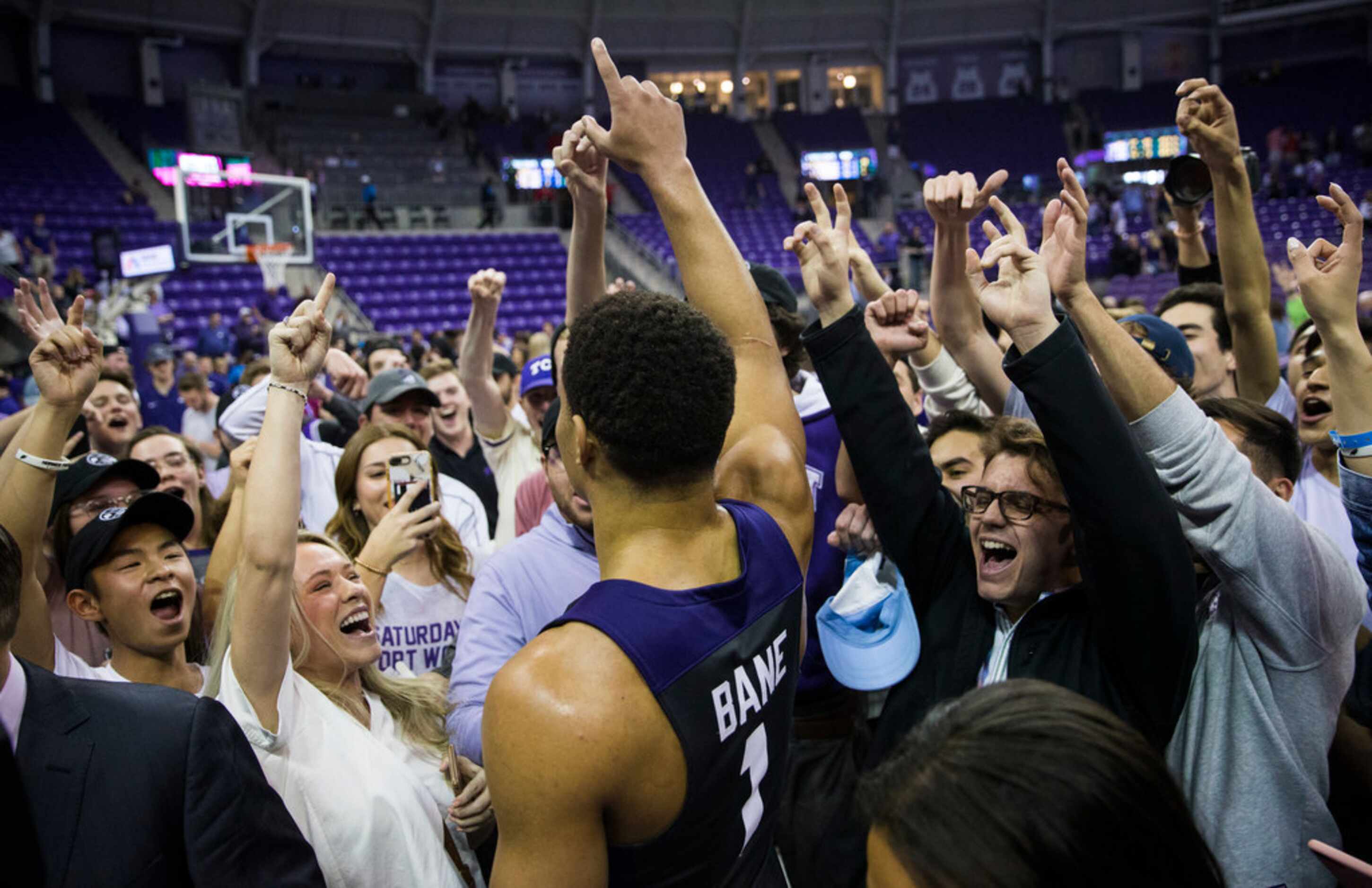 TCU Horned Frogs guard Desmond Bane (1) celebrates after fans rush the court because of a...