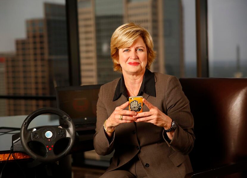 
Cathy Coughlin in her office with a texting-while-driving simulator used in high school...