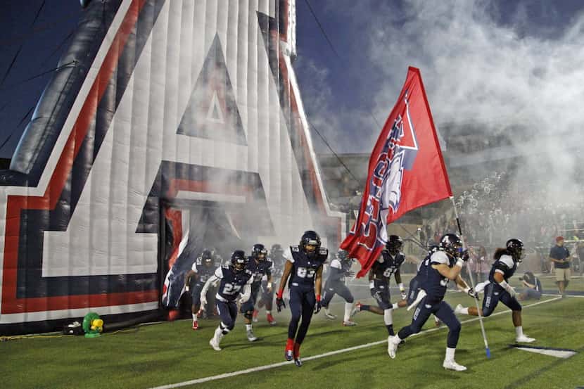The Allen High School football team takes the field before kickoff as they hosted Plano West...