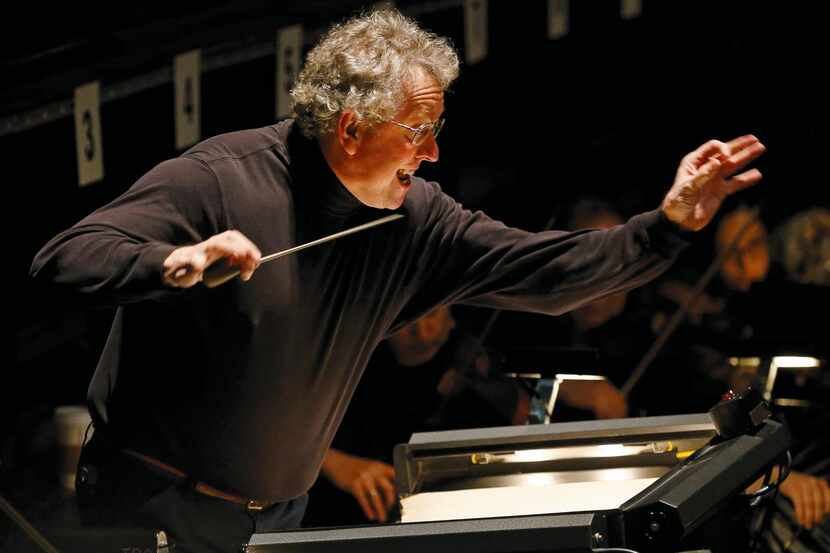 Graeme Jenkins,  former Dallas Opera music director, conducts the orchestra during a...