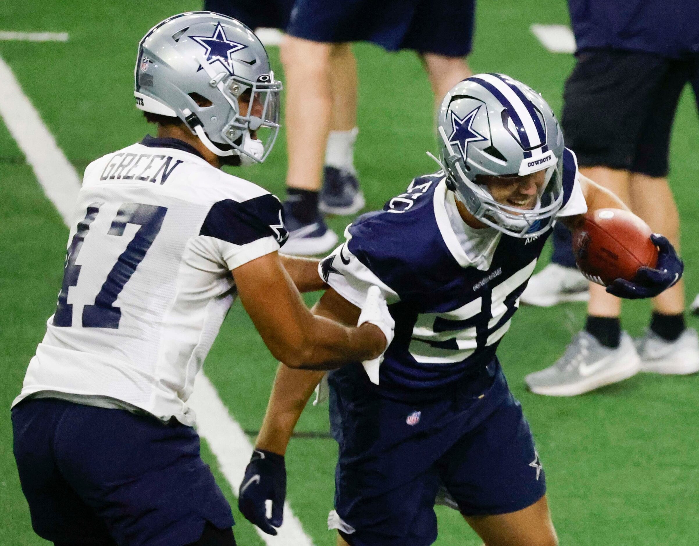 Dallas Cowboys tight end Seth Green (47) and linebacker Leighton Vander Esch (55) take part...