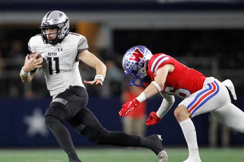 Denton Guyer quarterback Jackson Arnold (11) scrambles out of the backfield to avoid the...
