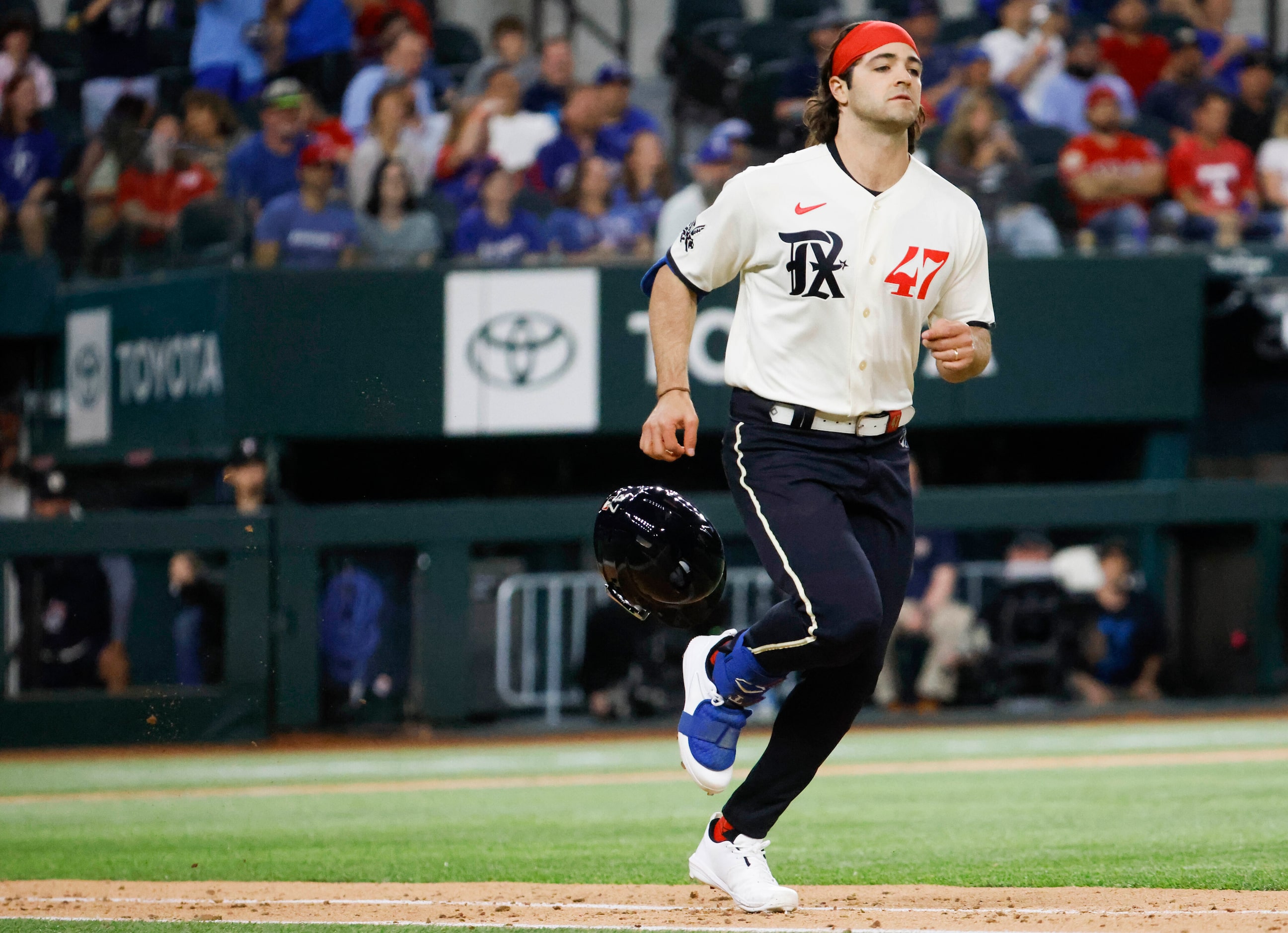 Texas Rangers shortstop Josh Smith out at first base during the ninth  inning of a baseball...