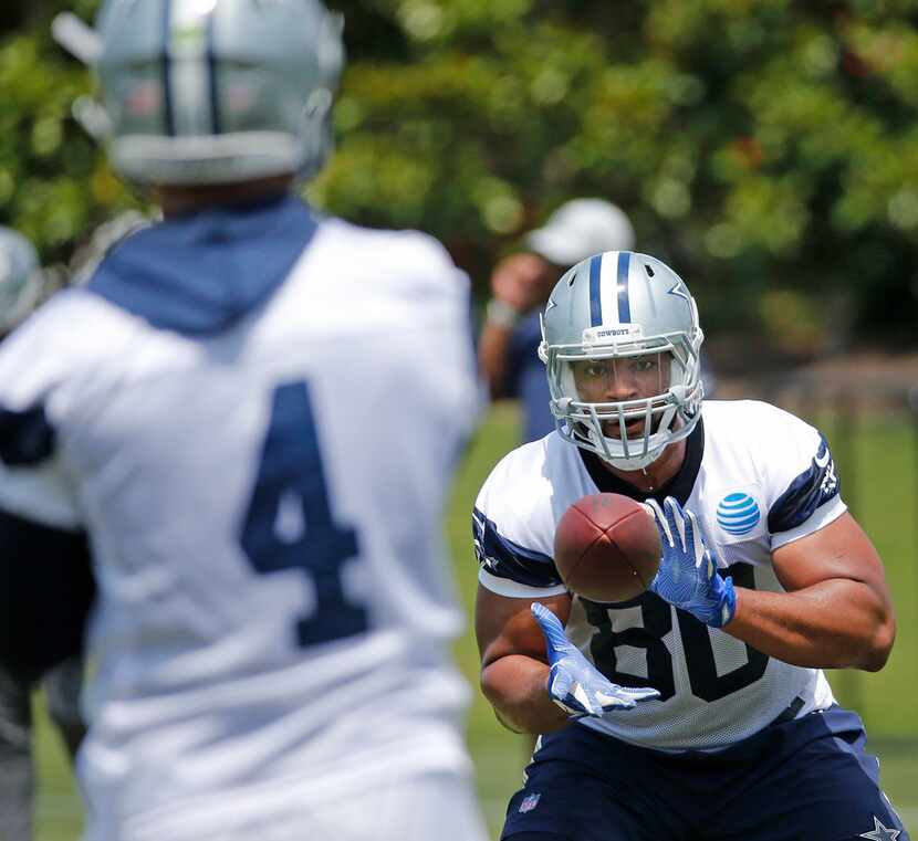 Cowboys tight end Rico Gathers (80) catches a pass from quarterback Dak Prescott (4) during...