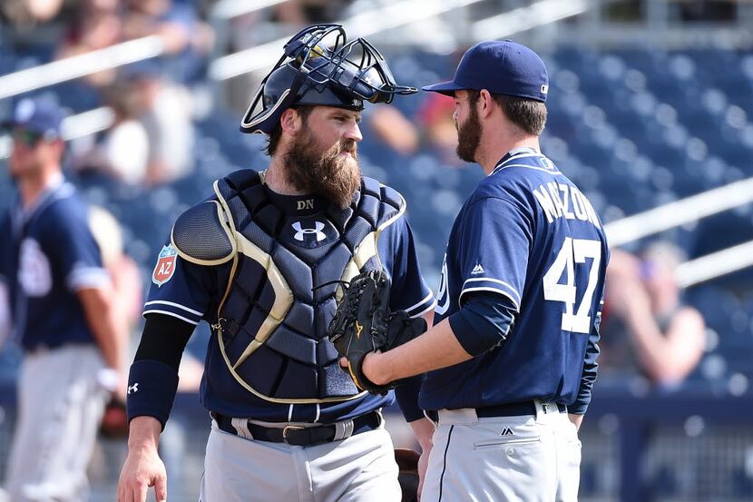 PEORIA, AZ - MARCH 02:  Derek Norris #3 of the San Diego Padres talks to his pitcher Cory...