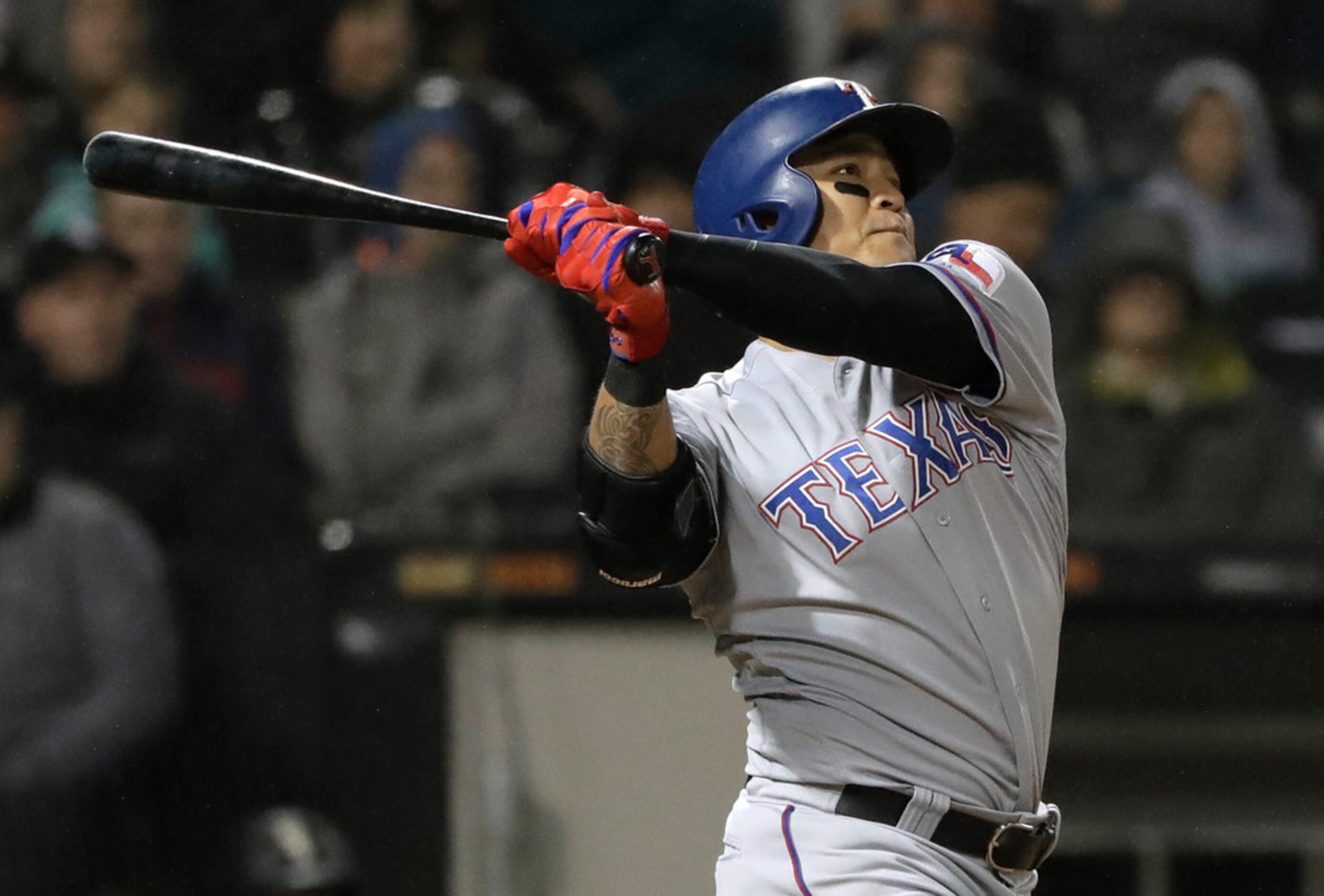 Texas Rangers' Shin-Soo Choo, of South Korea, hits a grand slam during the third inning of...