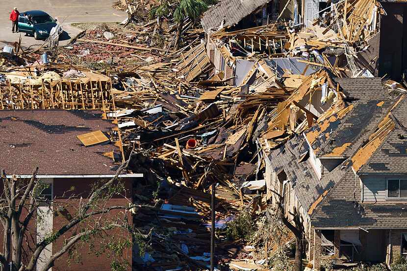Damaged homes near Walnut Hill and Marsh Lane are seen in aerial view of tornado damage on...