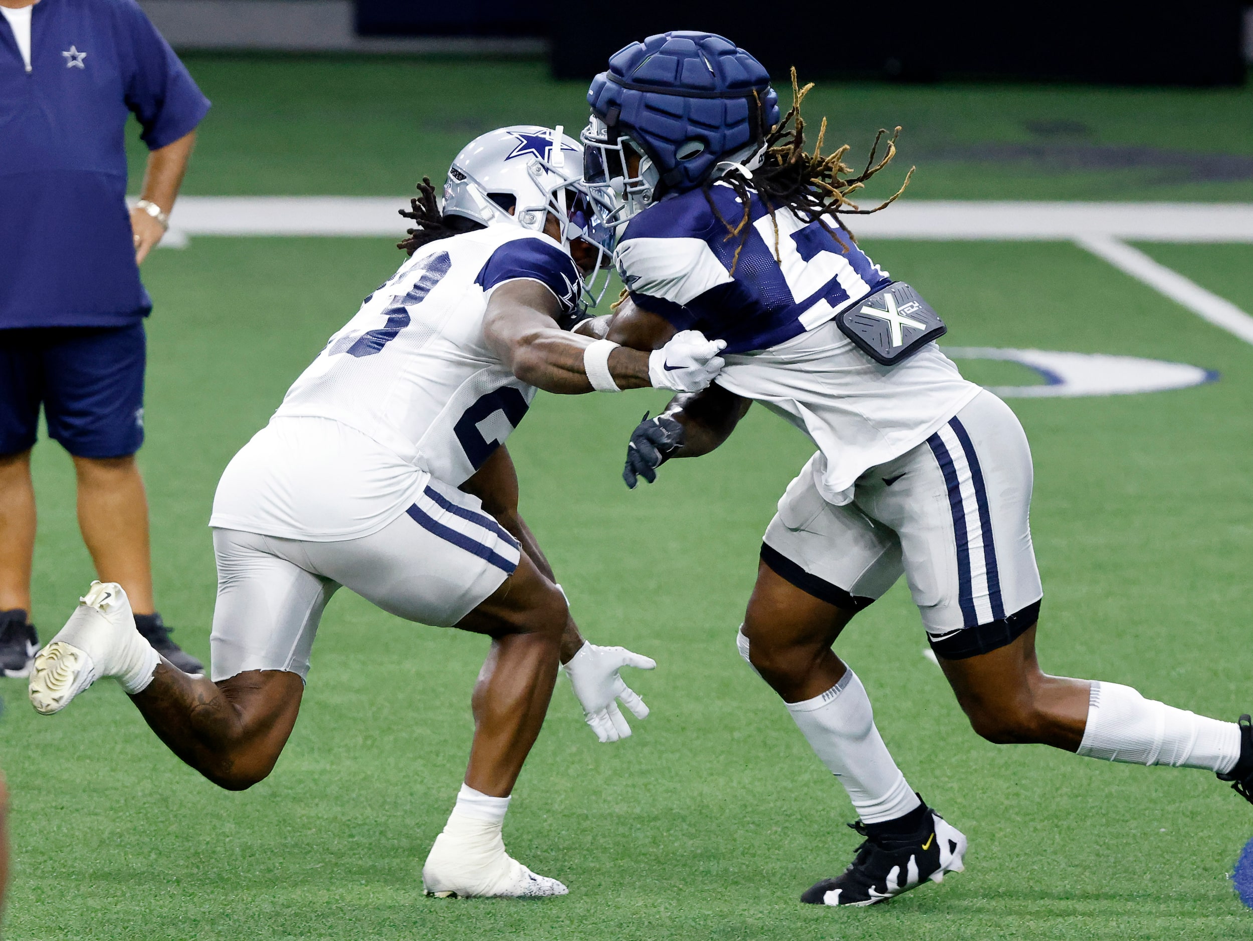 Dallas Cowboys running back Rico Dowdle (23) attempts to block linebacker Buddy Johnson (57)...