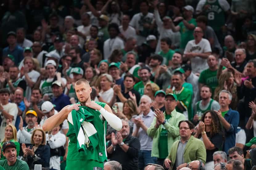 Boston Celtics center Kristaps Porzingis gets a standing ovation as he checks into the game...