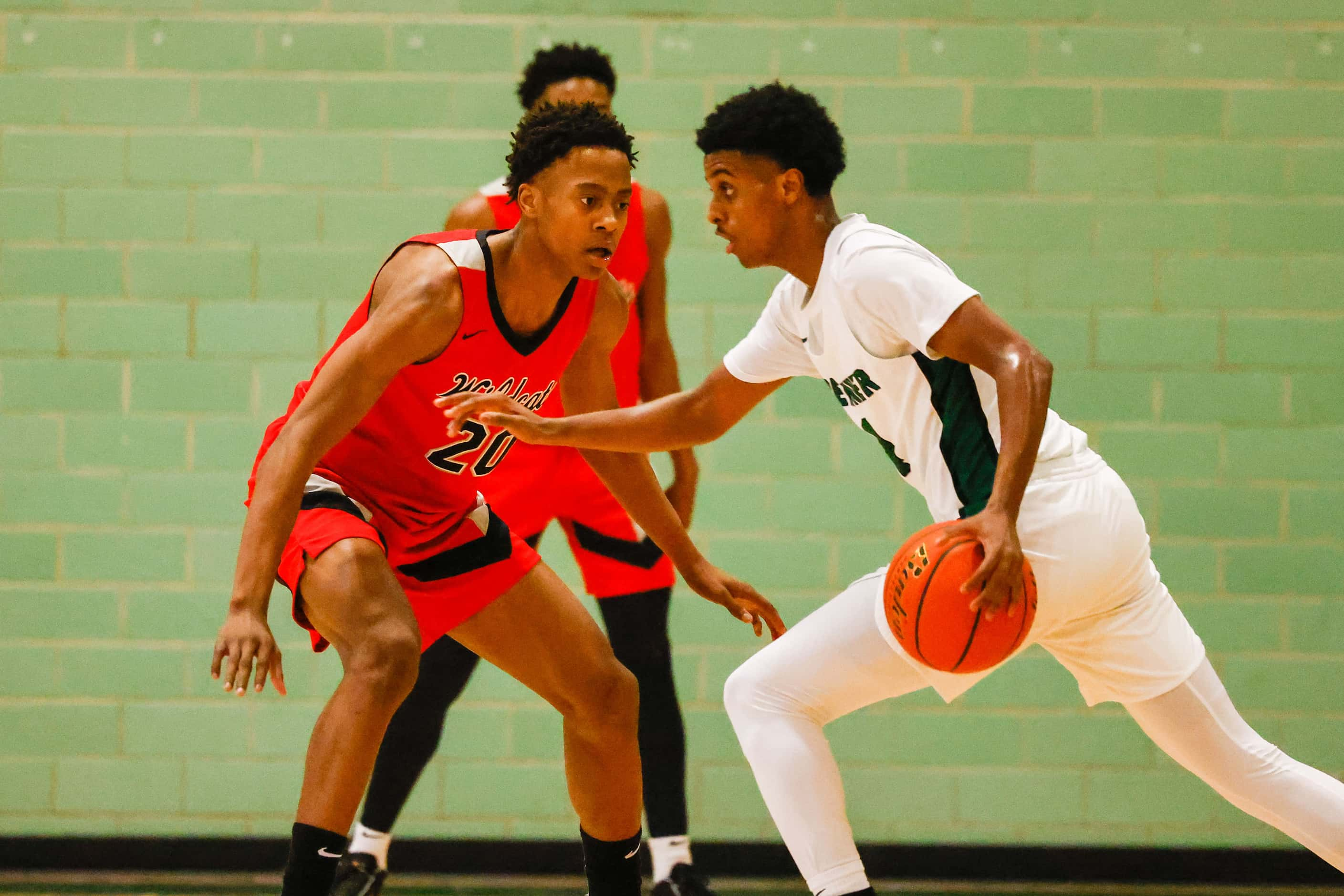 Lake Highlands High School' Tre Johnson #20, tries to block Berkner High School' Adonai...