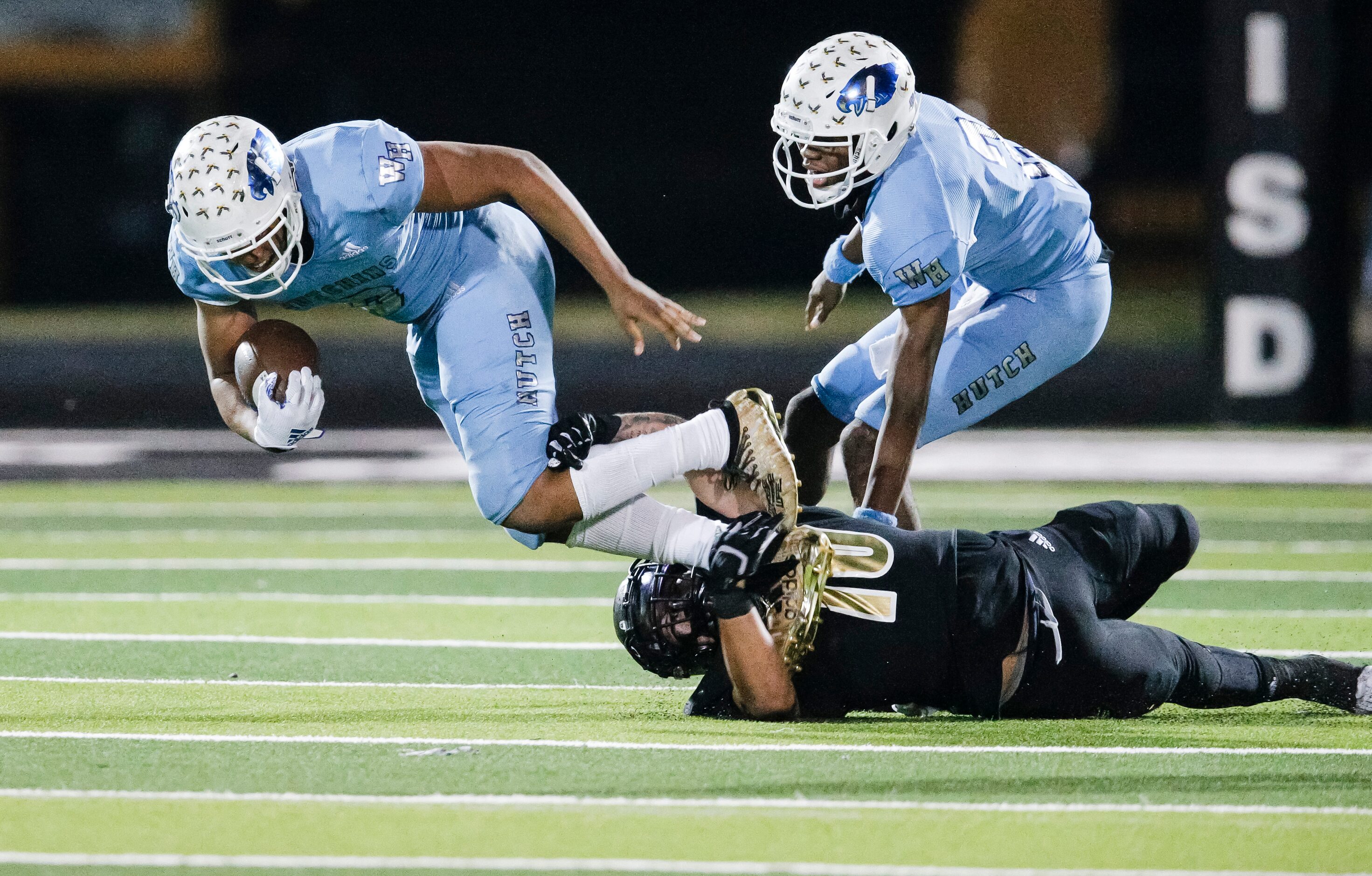 Kaufman sophomore linebacker Isaiah Leija (10) tackles Wilmer-Hutchins senior running back...