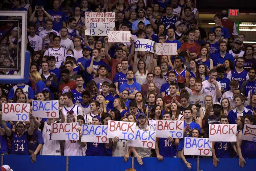 LAWRENCE, KS - FEBRUARY 22: Kansas Jayhawks fans hold up signs as Kansas prepares to win...