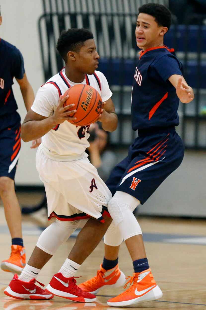 Allen gaurd Evan Smith (24) passes as Wakeland forward Devin Roland (5) defends during the...