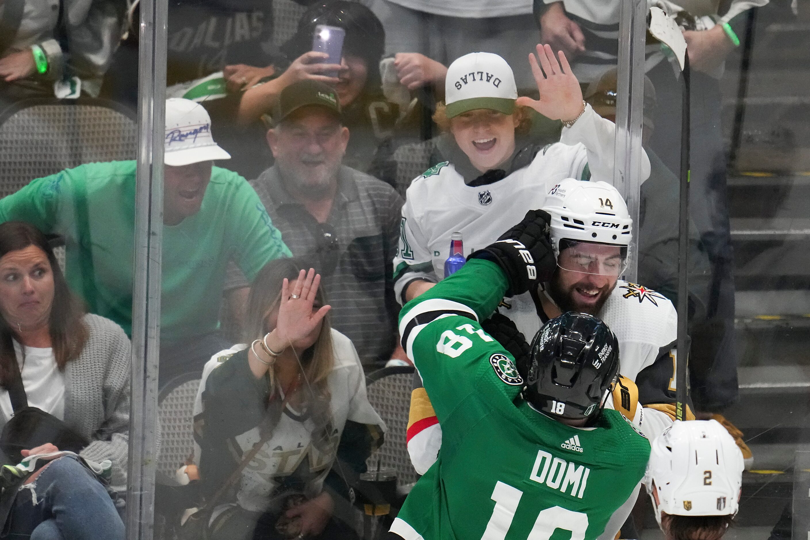 Vegas Golden Knights defenseman Nicolas Hague (14) tussles with Dallas Stars center Max Domi...