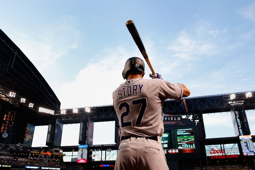 PHOENIX, AZ - APRIL 04:  Trevor Story #27 of the Colorado Rockies warms up on deck before...